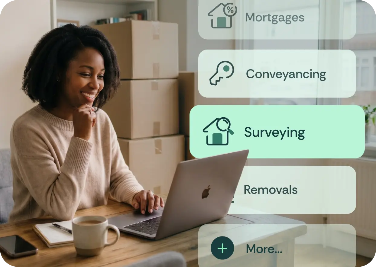 Woman using a laptop to find trusted professionals for mortgages, conveyancing, surveying, and removals.