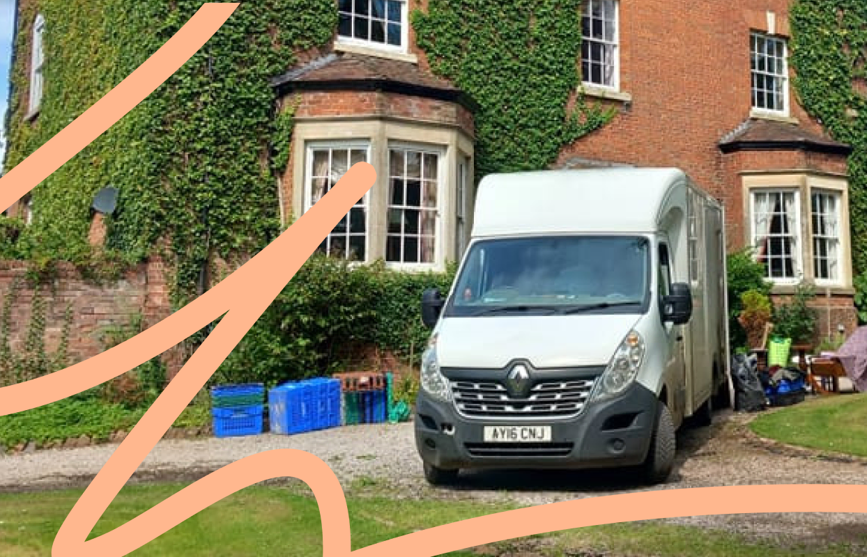 Removal van parked outside a UK home during a house move.