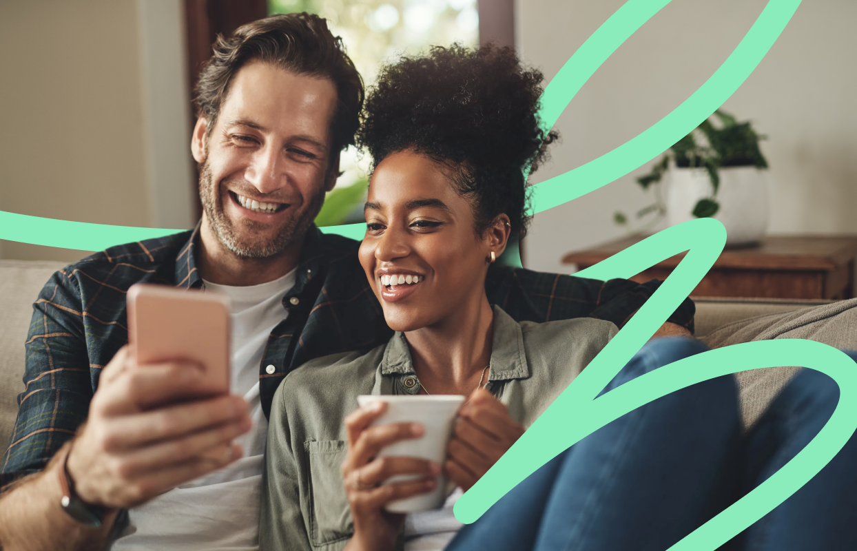 Couple using a phone at home to find trusted professionals with Konnect You.